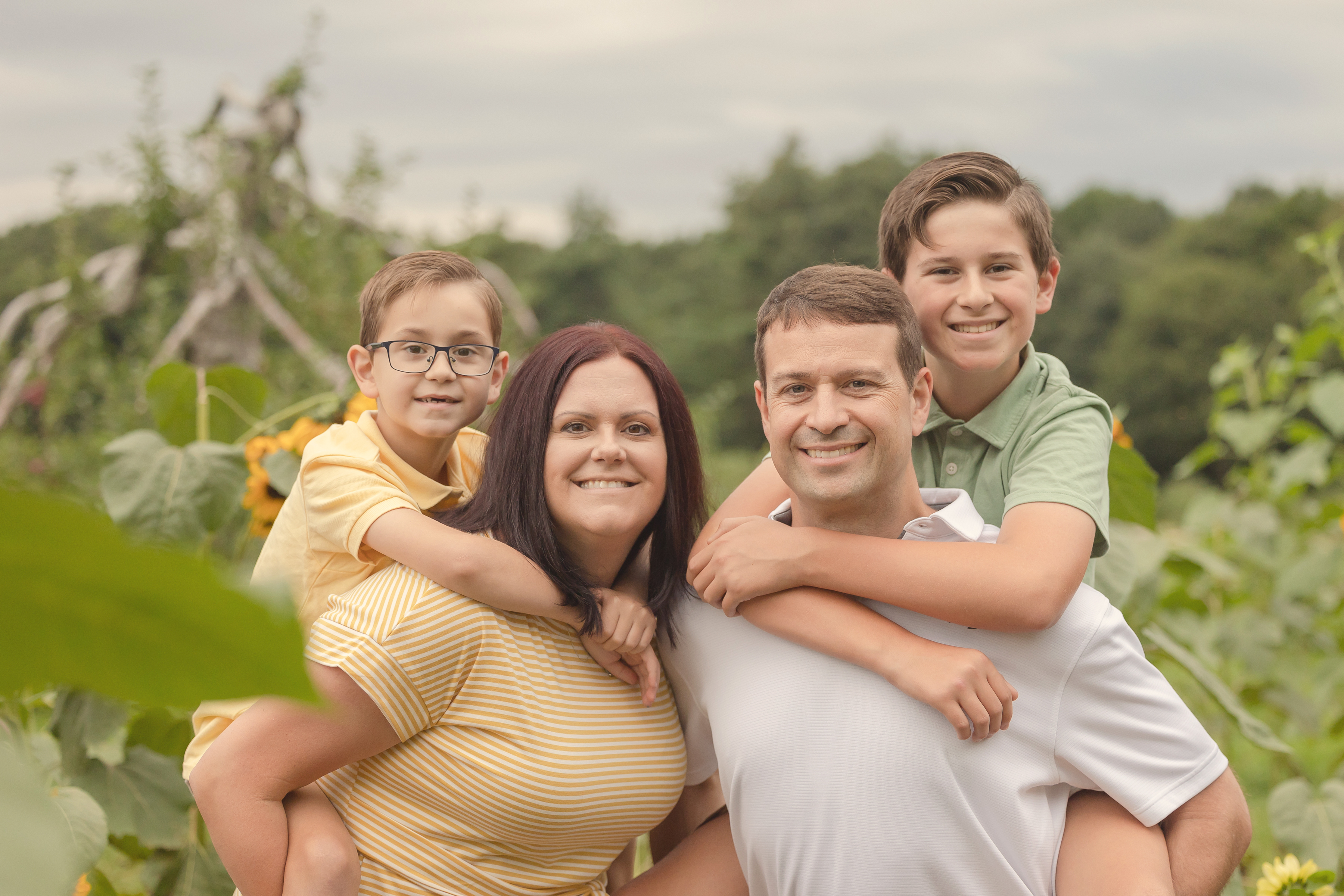 *A photo of Brian with his wife Elizabeth and their sons, Benjamin (8) and Ethan (12).* A family photo from the author.